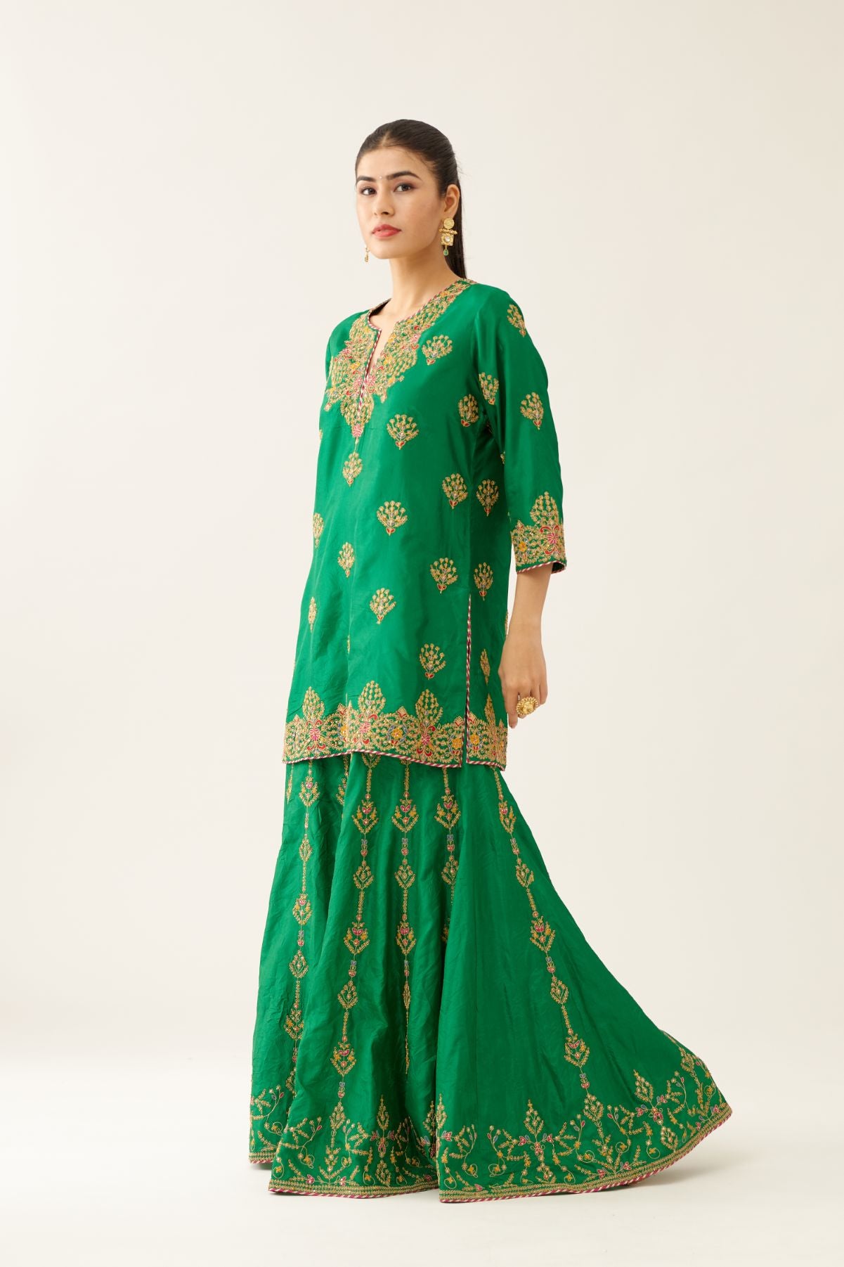 Green silk short kurta set, with dori & silk thread embroidery highlighted with contrast bead & sequins work.