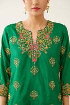 Green silk short kurta set, with dori & silk thread embroidery highlighted with contrast bead & sequins work.