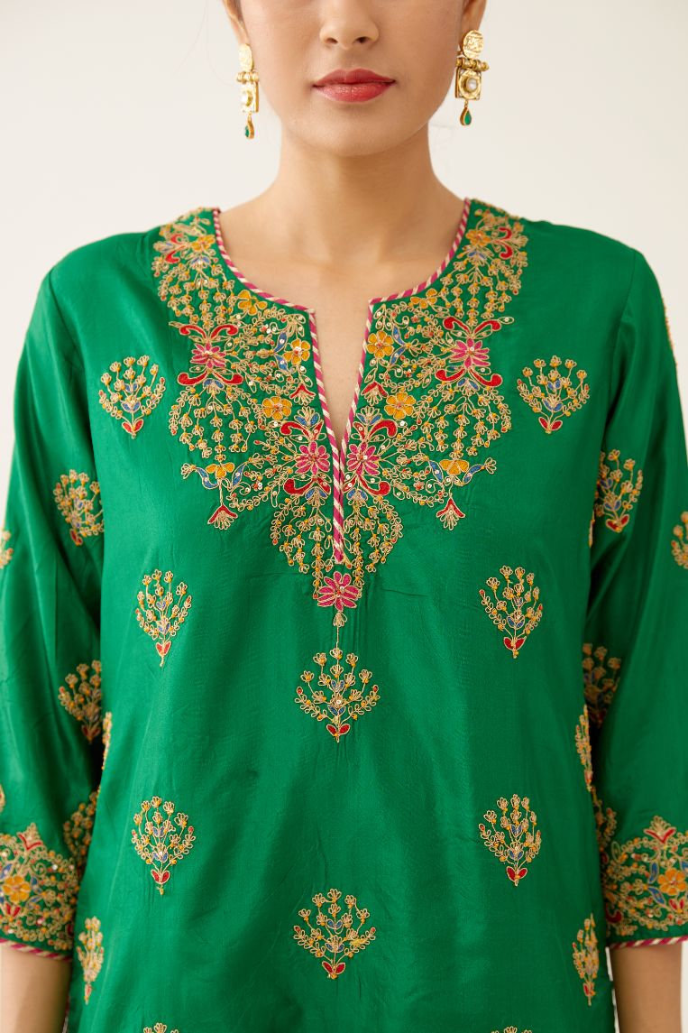 Green silk short kurta set, with dori & silk thread embroidery highlighted with contrast bead & sequins work.