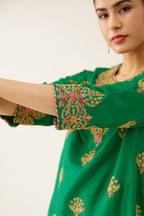 Green silk short kurta set, with dori & silk thread embroidery highlighted with contrast bead & sequins work.
