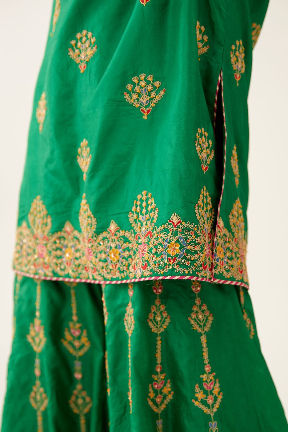 Green silk short kurta set, with dori & silk thread embroidery highlighted with contrast bead & sequins work.