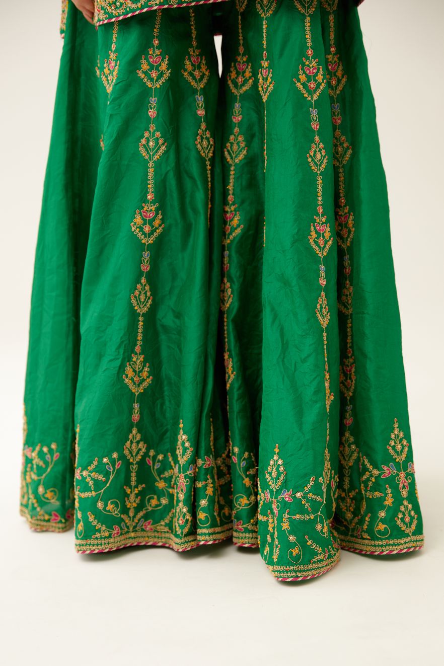 Green silk short kurta set, with dori & silk thread embroidery highlighted with contrast bead & sequins work.