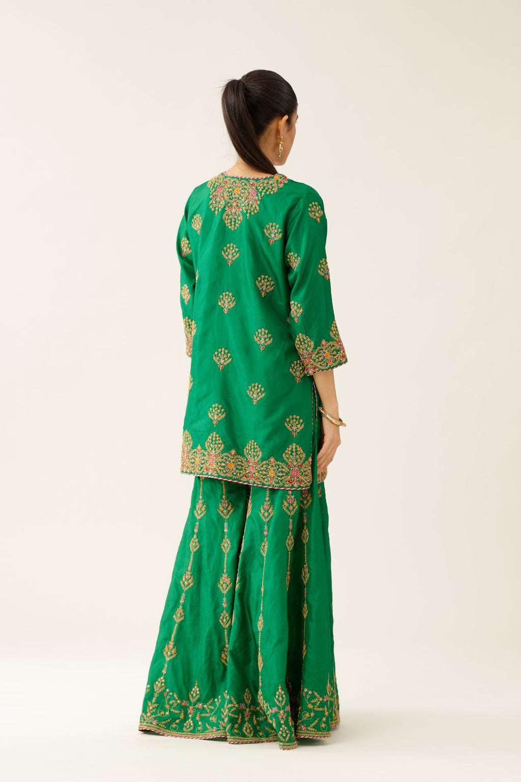 Green silk short kurta set, with dori & silk thread embroidery highlighted with contrast bead & sequins work.