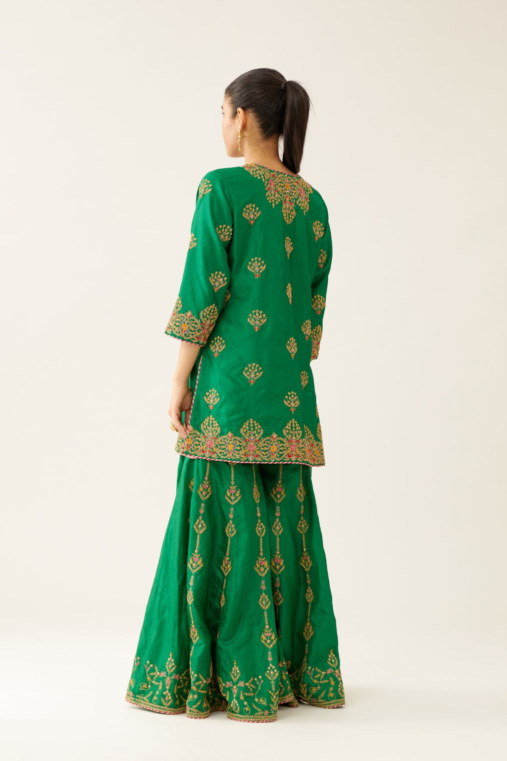 Green silk short kurta set, with dori & silk thread embroidery highlighted with contrast bead & sequins work.