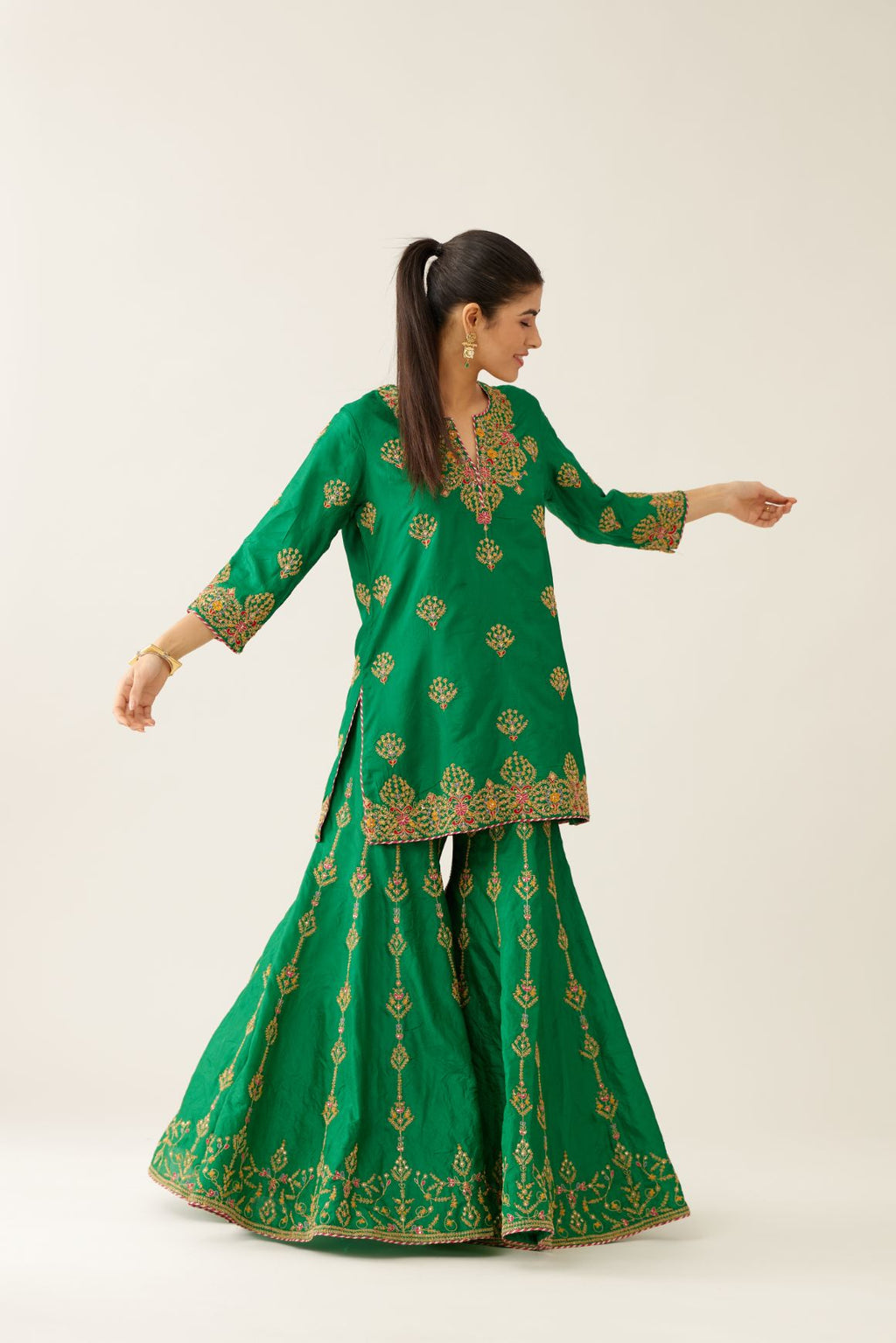 Green silk short kurta set, with dori & silk thread embroidery highlighted with contrast bead & sequins work.