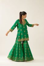 Green silk short kurta set, with dori & silk thread embroidery highlighted with contrast bead & sequins work.