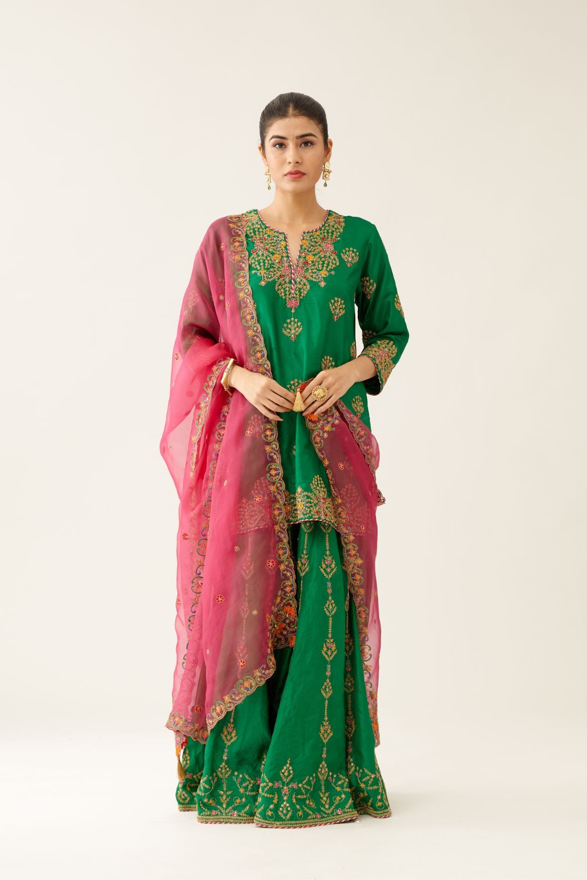 Green silk short kurta set, with dori & silk thread embroidery highlighted with contrast bead & sequins work.