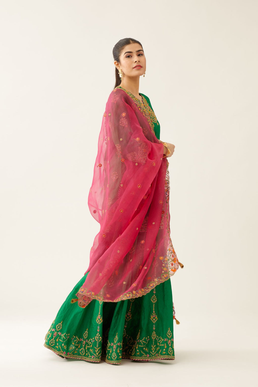 Green silk short kurta set, with dori & silk thread embroidery highlighted with contrast bead & sequins work.
