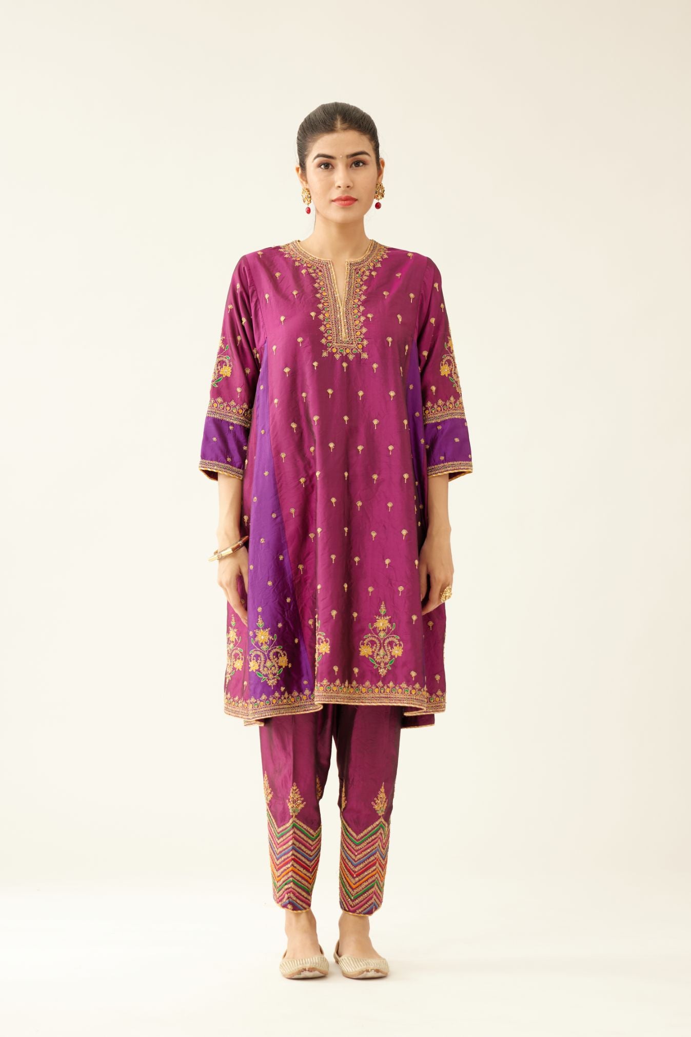 Sangria & plum purple silk short kalidar kurta set with all over dori & silk thread embroidery, highlighted with contrast bead & sequins work.
