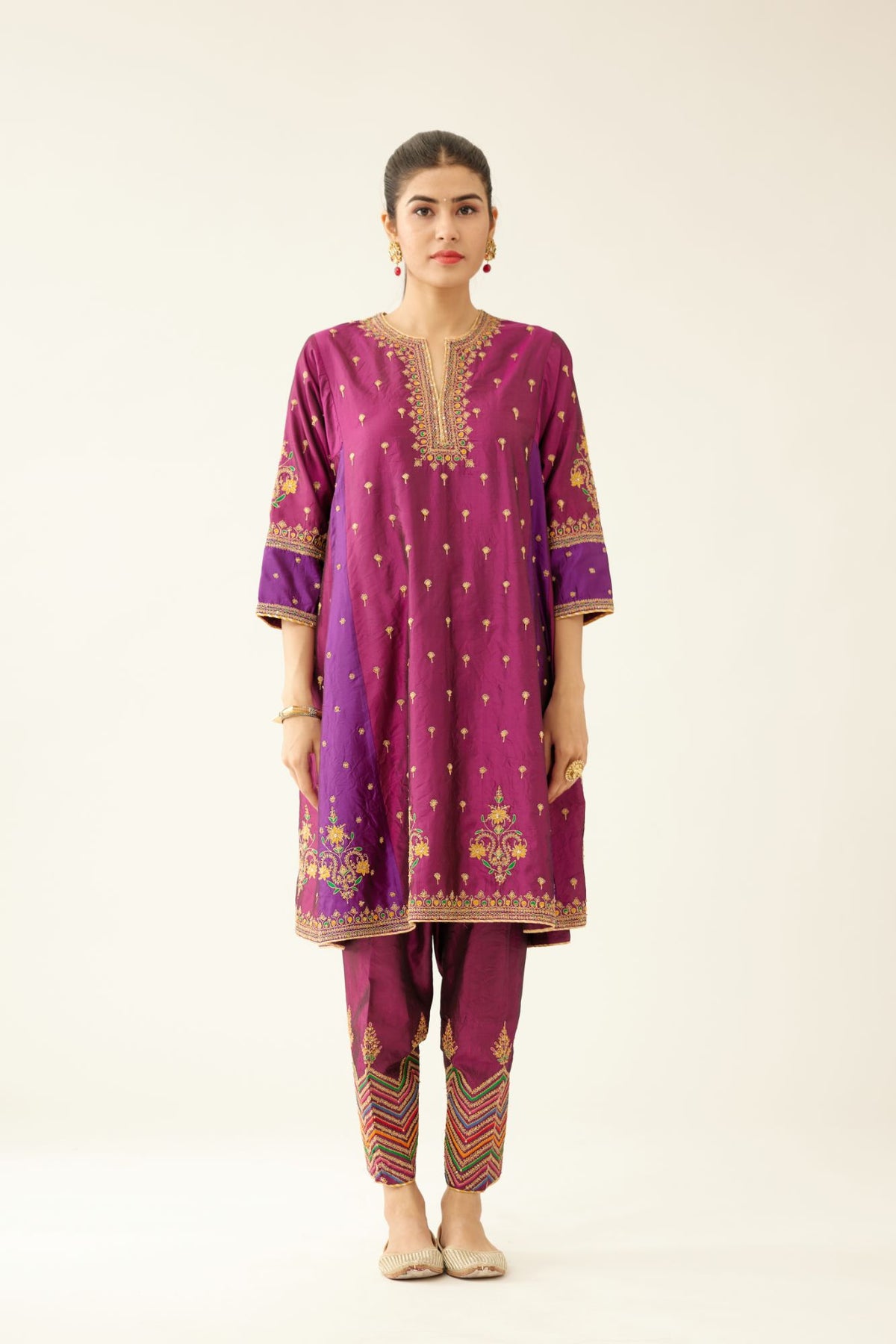 Sangria & plum purple silk short kalidar kurta set with all over dori & silk thread embroidery, highlighted with contrast bead & sequins work.