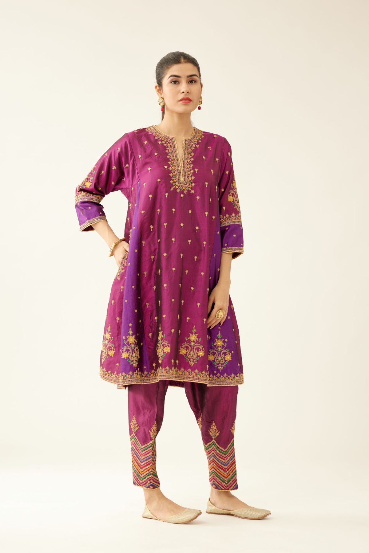 Sangria & plum purple silk short kalidar kurta set with all over dori & silk thread embroidery, highlighted with contrast bead & sequins work.