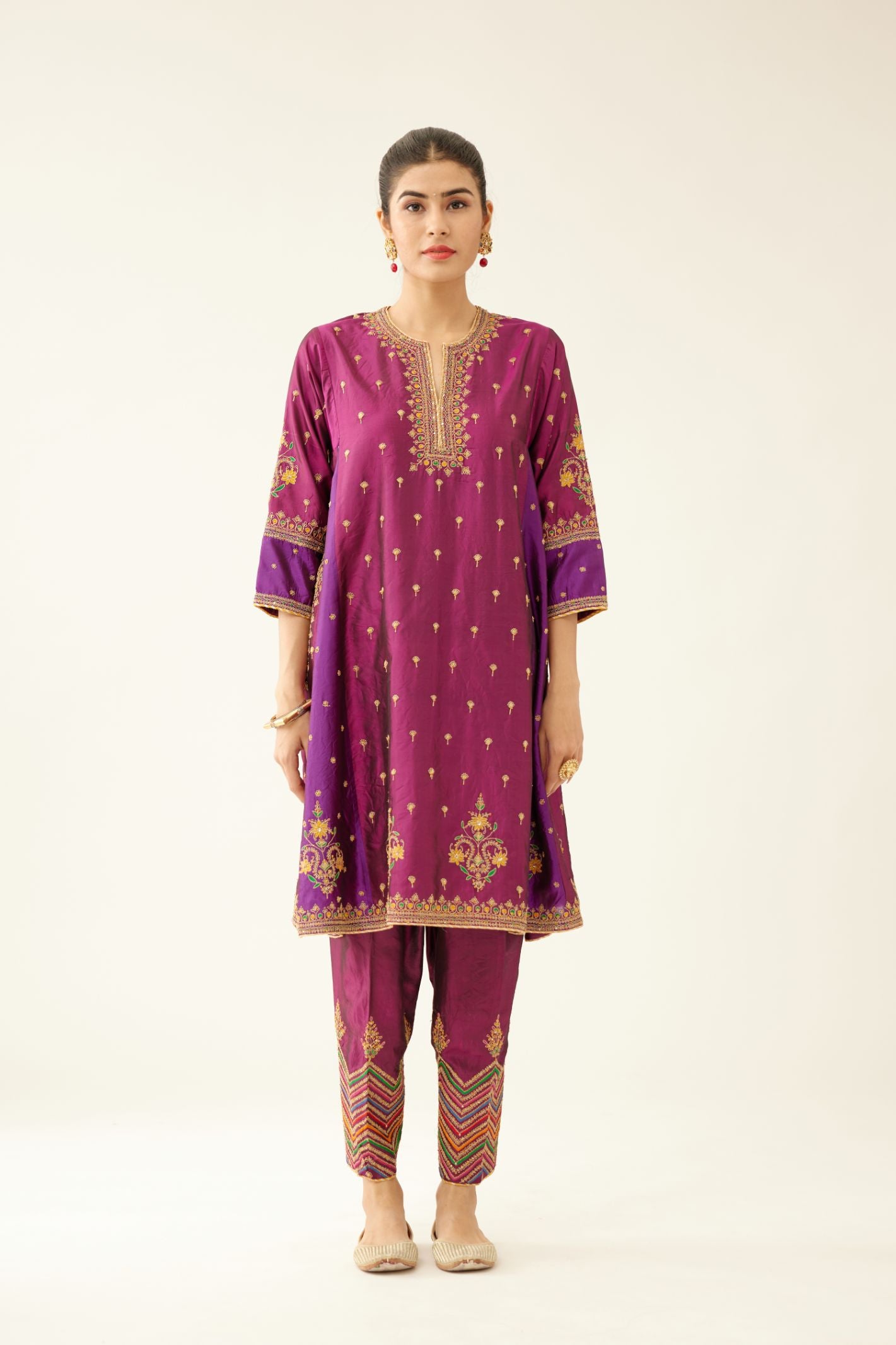 Sangria & plum purple silk short kalidar kurta set with all over dori & silk thread embroidery, highlighted with contrast bead & sequins work.