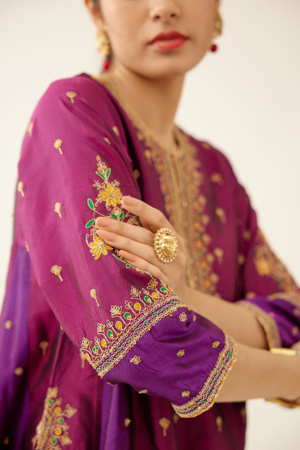 Sangria & plum purple silk short kalidar kurta set with all over dori & silk thread embroidery, highlighted with contrast bead & sequins work.