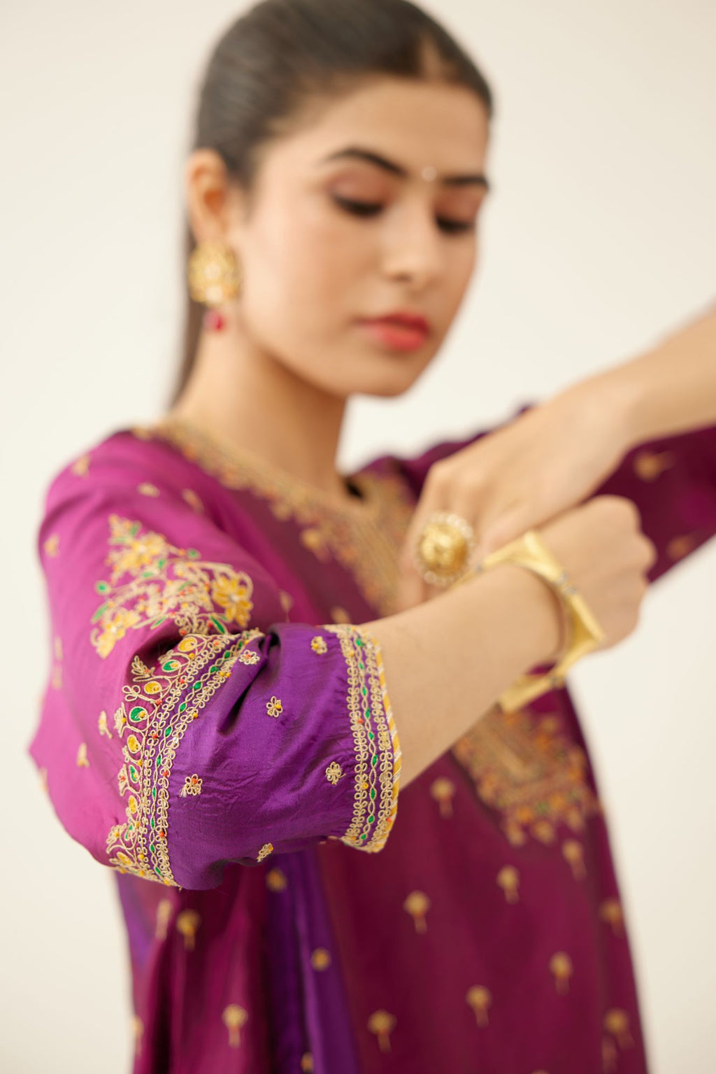 Sangria & plum purple silk short kalidar kurta set with all over dori & silk thread embroidery, highlighted with contrast bead & sequins work.