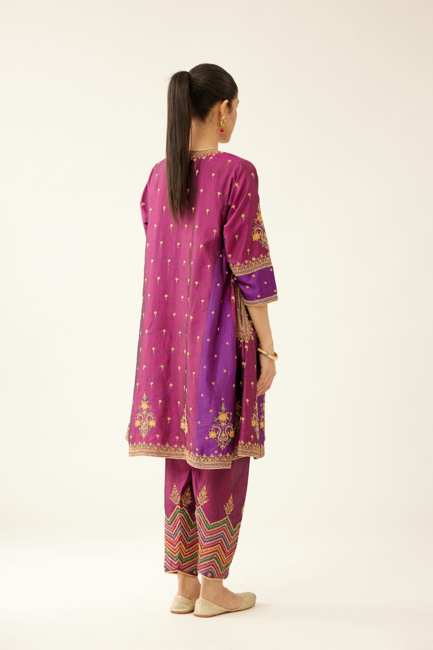 Sangria & plum purple silk short kalidar kurta set with all over dori & silk thread embroidery, highlighted with contrast bead & sequins work.
