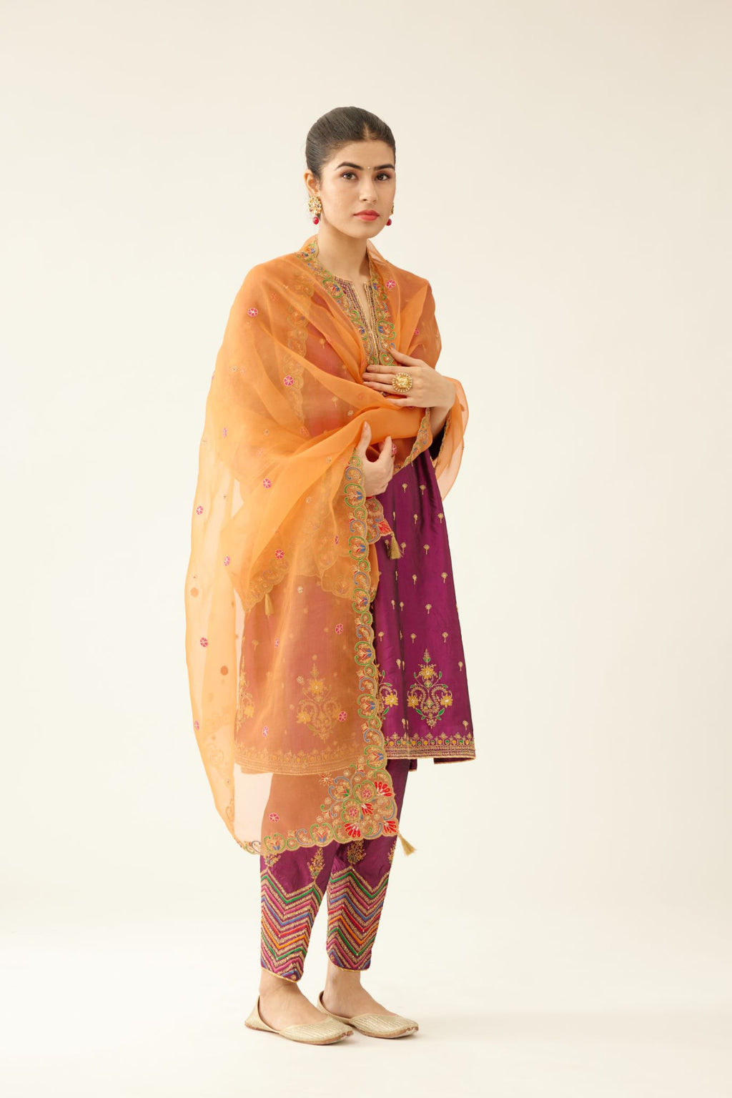 Sangria & plum purple silk short kalidar kurta set with all over dori & silk thread embroidery, highlighted with contrast bead & sequins work.