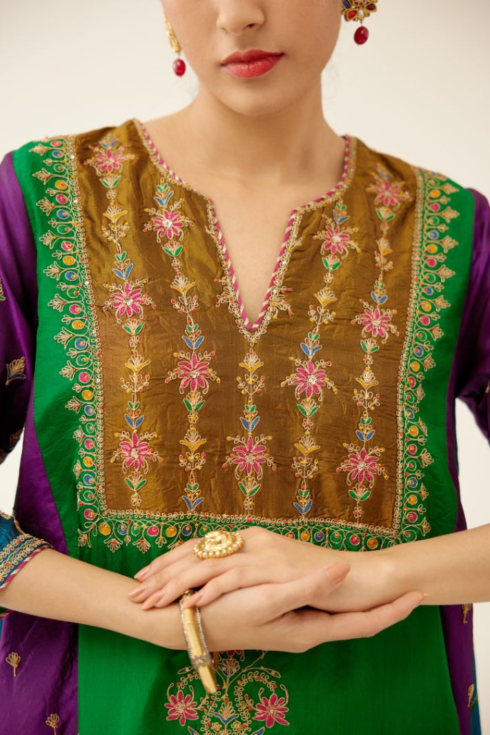 Color blocked multi panelled silk kurta dress set with asymmetric hem, highlighted with all over delicate dori & silk thread embroidery.
