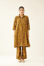 Golden olive A-line short silk kurta set with all over embroidery, highlighted with sequins and bead work, paired with golden olive silk straight pants with dori and silk thread embroidery.