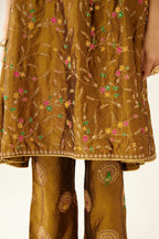 Golden olive A-line short silk kurta set with all over embroidery, highlighted with sequins and bead work, paired with golden olive silk straight pants with dori and silk thread embroidery.