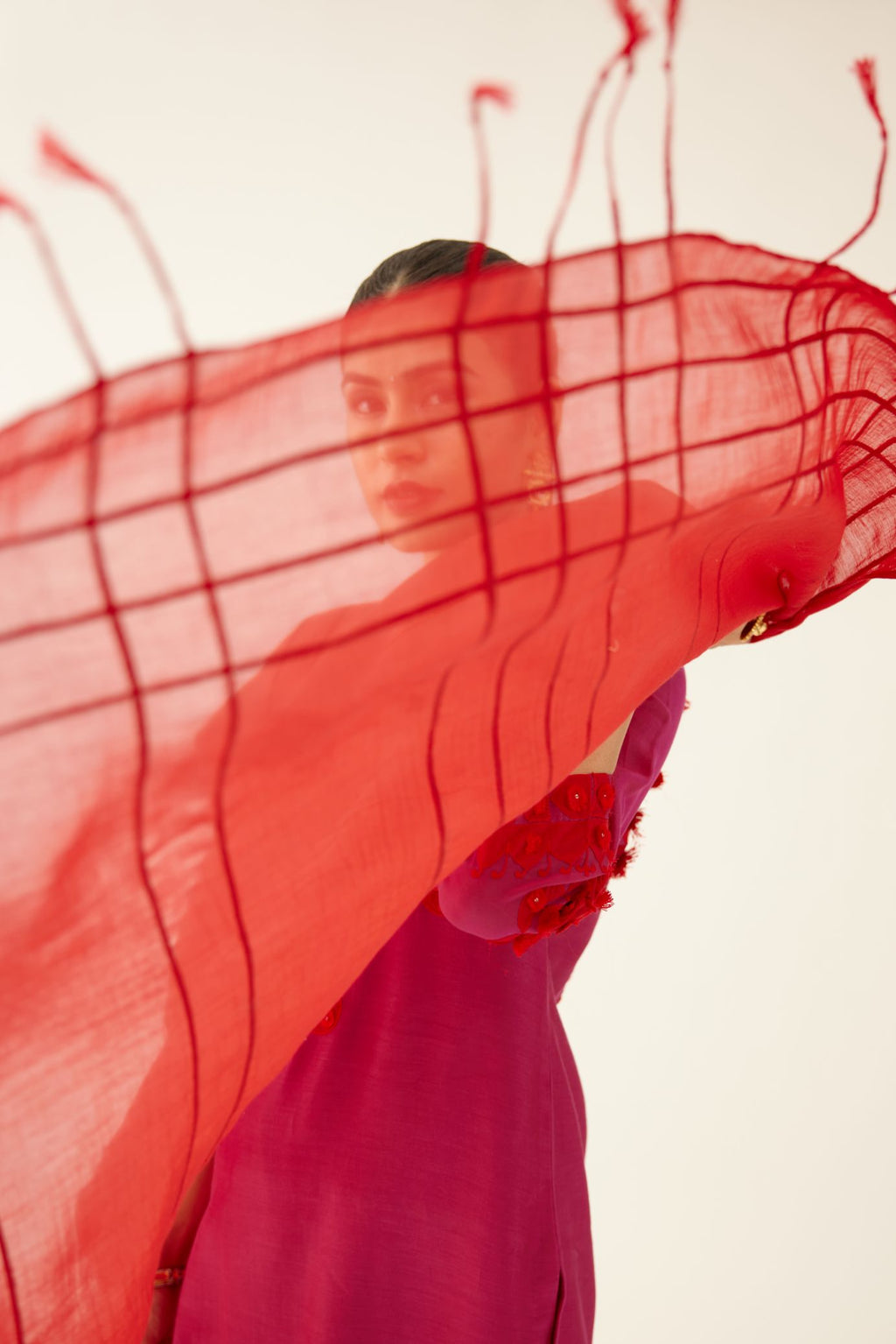 Red cotton Chanderi dupatta, highlighted with braided threaded at all-over the dupatta.