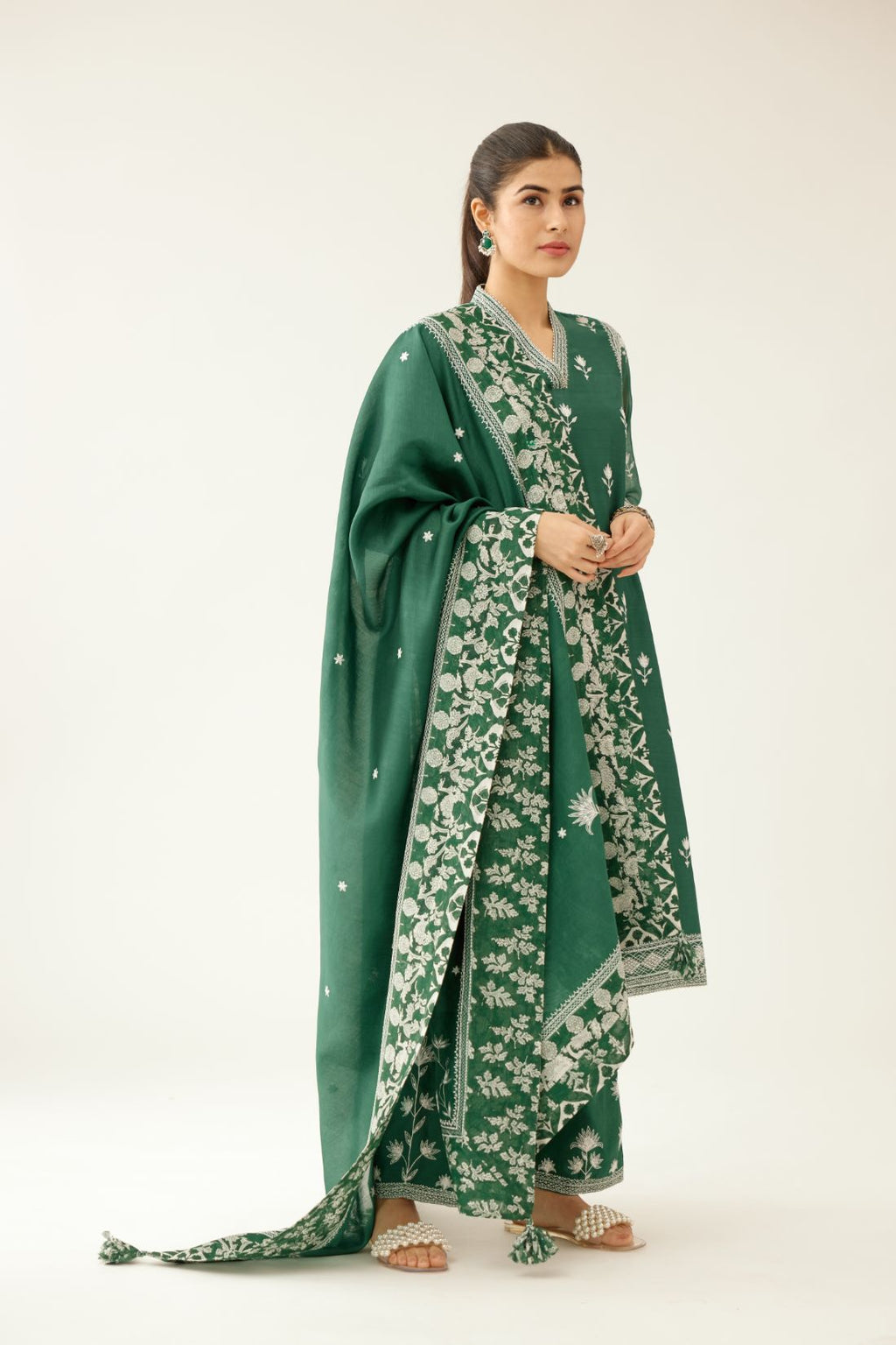 Green silk chanderi mid length straight kurta set with all over off white silk thread embroidery.
