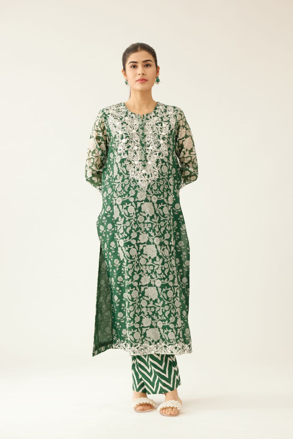Green hand block printed kalidar straight kurta set, highlighted with sequin, tassels & bead work.