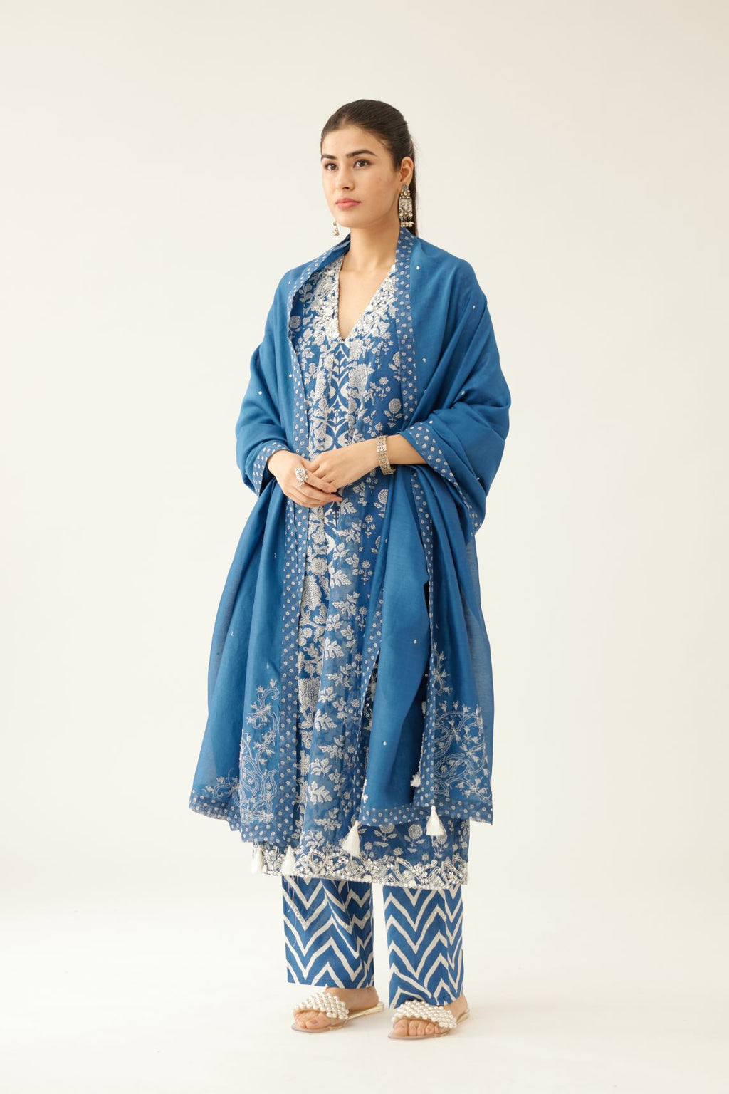 Blue hand block printed kurta dress set with a V neck, detailed with sequin, tassels and bead work.