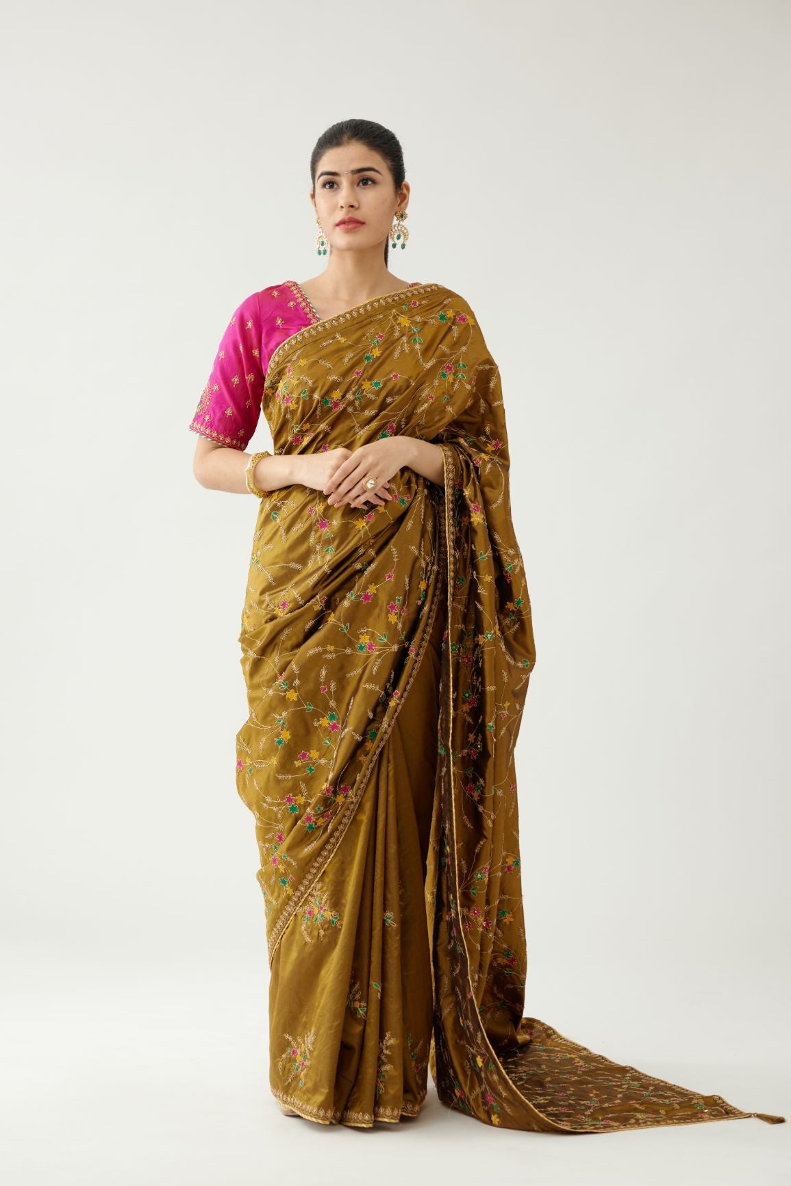 Golden olive silk saree set, detailed with all over delicate dori and silk thread embroidery work, paired with raspberry silk blouse with princess seams and all-over delicate dori and silk thread embroidered.