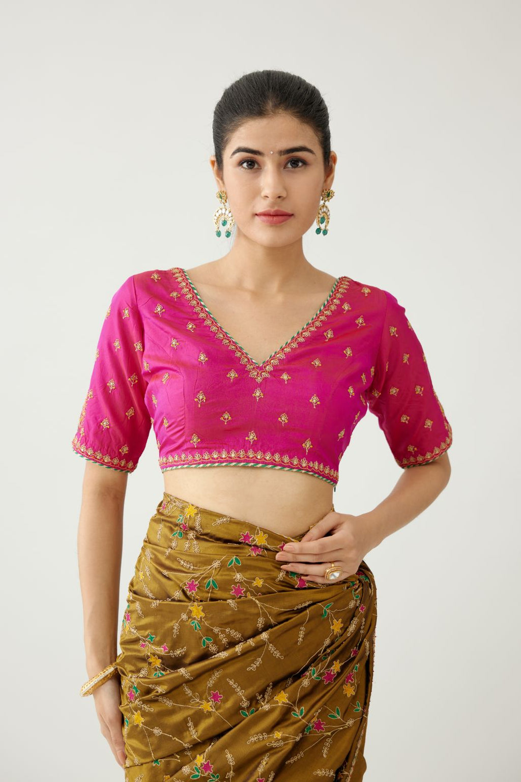 Golden olive silk saree set, detailed with all over delicate dori and silk thread embroidery work, paired with raspberry silk blouse with princess seams and all-over delicate dori and silk thread embroidered.