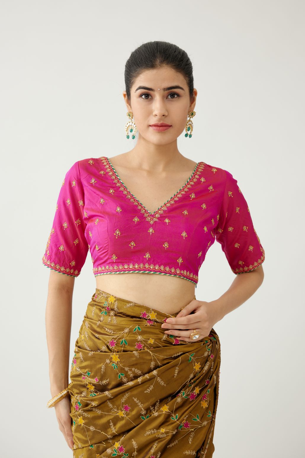 Golden olive silk saree set, detailed with all over delicate dori and silk thread embroidery work, paired with raspberry silk blouse with princess seams and all-over delicate dori and silk thread embroidered.