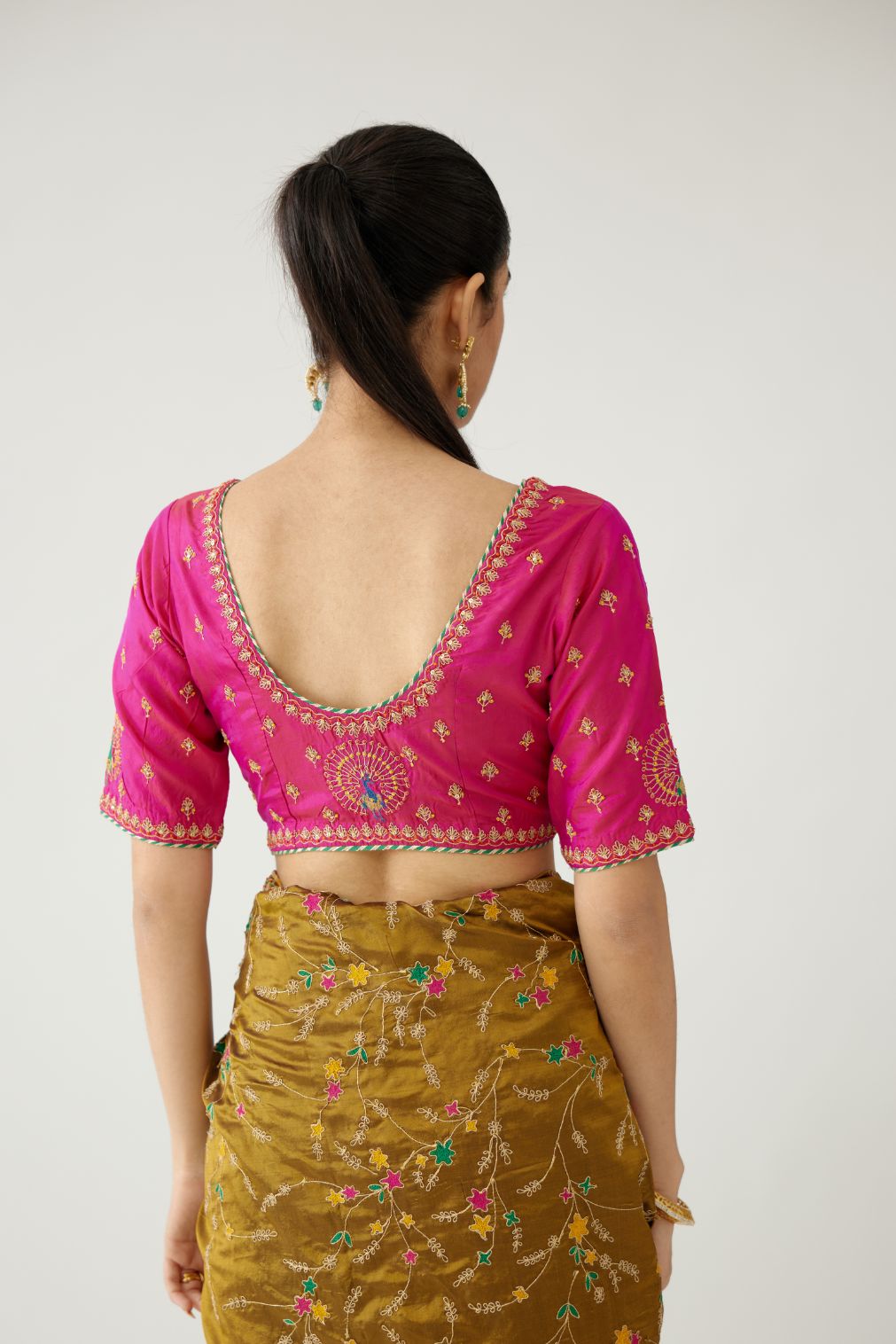 Raspberry silk blouse with princess seams and all-over delicate dori and silk thread embroidered.