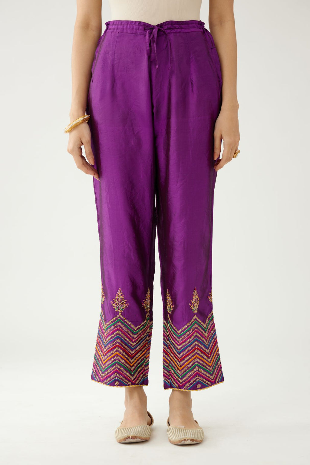 Plum purple silk pants detailed with dori, silk thread, bead & sequins embroidery.