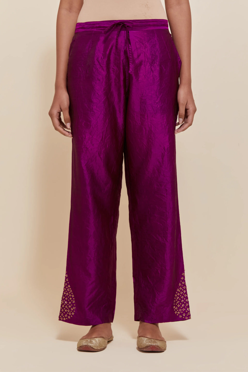 Purple Silk pants with hand embroidered leaf motifs with delicate sequins work at hem.