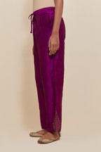 Purple Silk pants with hand embroidered leaf motifs with delicate sequins work at hem.