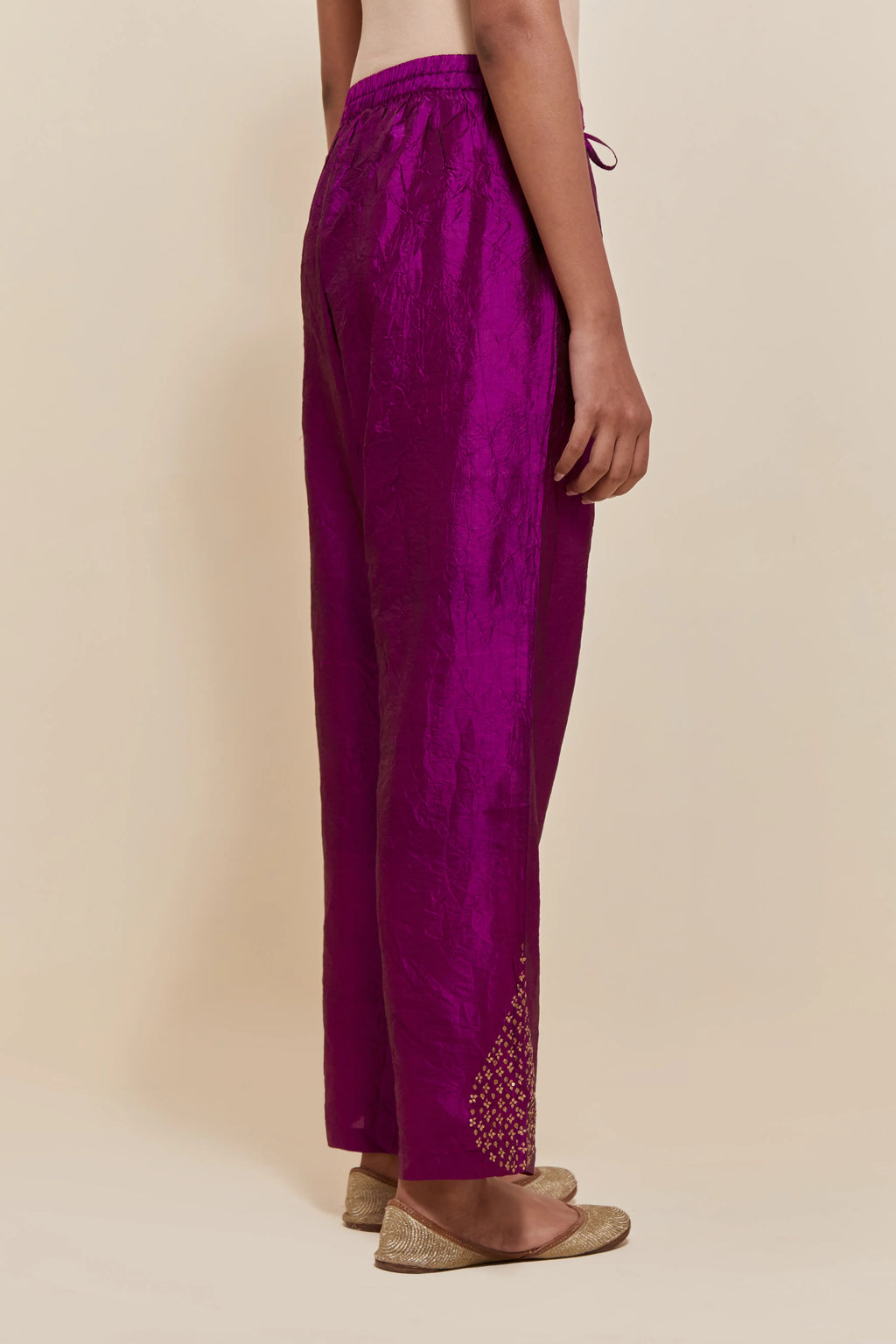 Purple Silk pants with hand embroidered leaf motifs with delicate sequins work at hem.