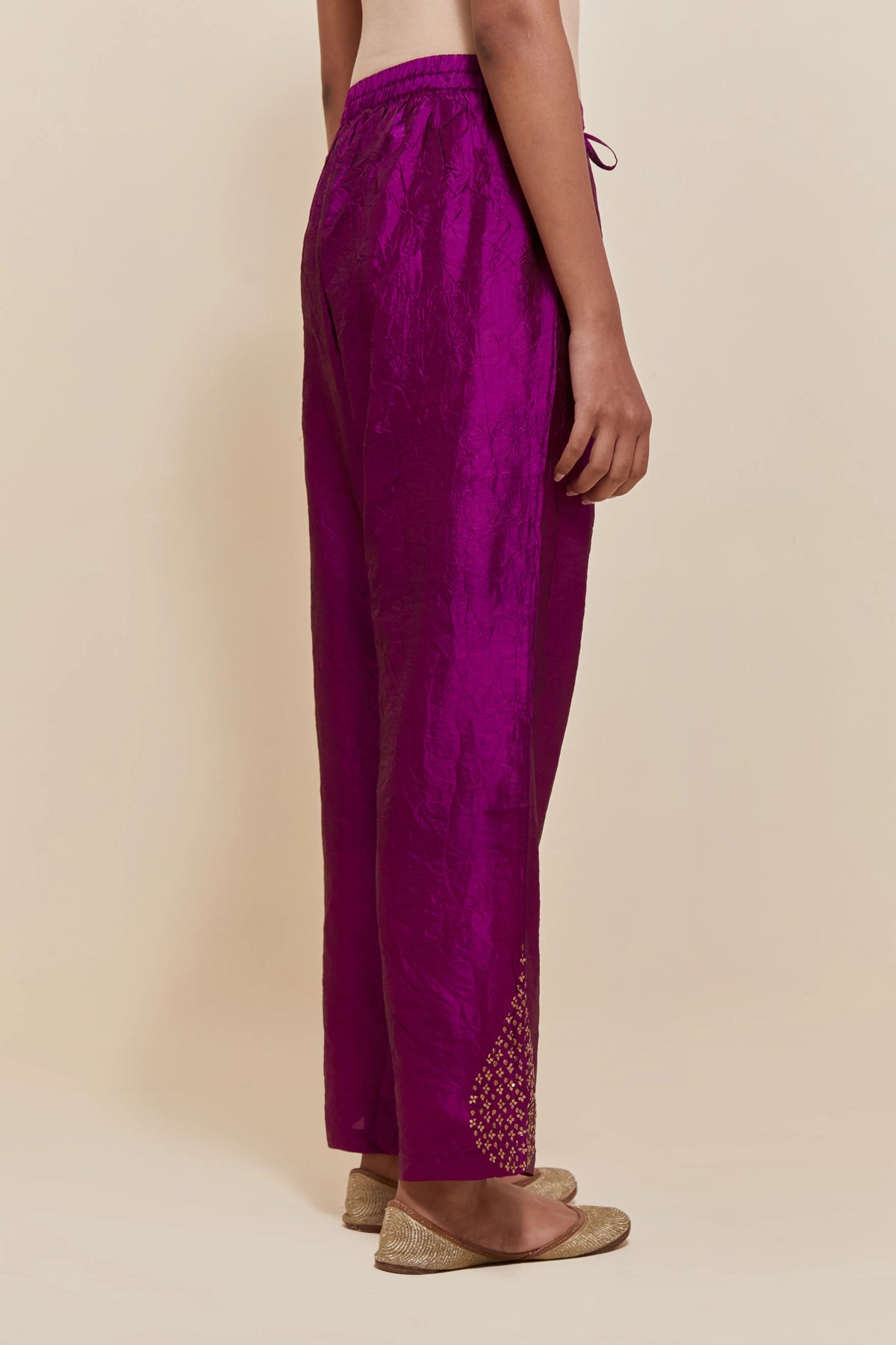 Purple Silk pants with hand embroidered leaf motifs with delicate sequins work at hem.