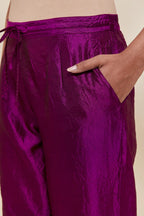 Purple Silk pants with hand embroidered leaf motifs with delicate sequins work at hem.