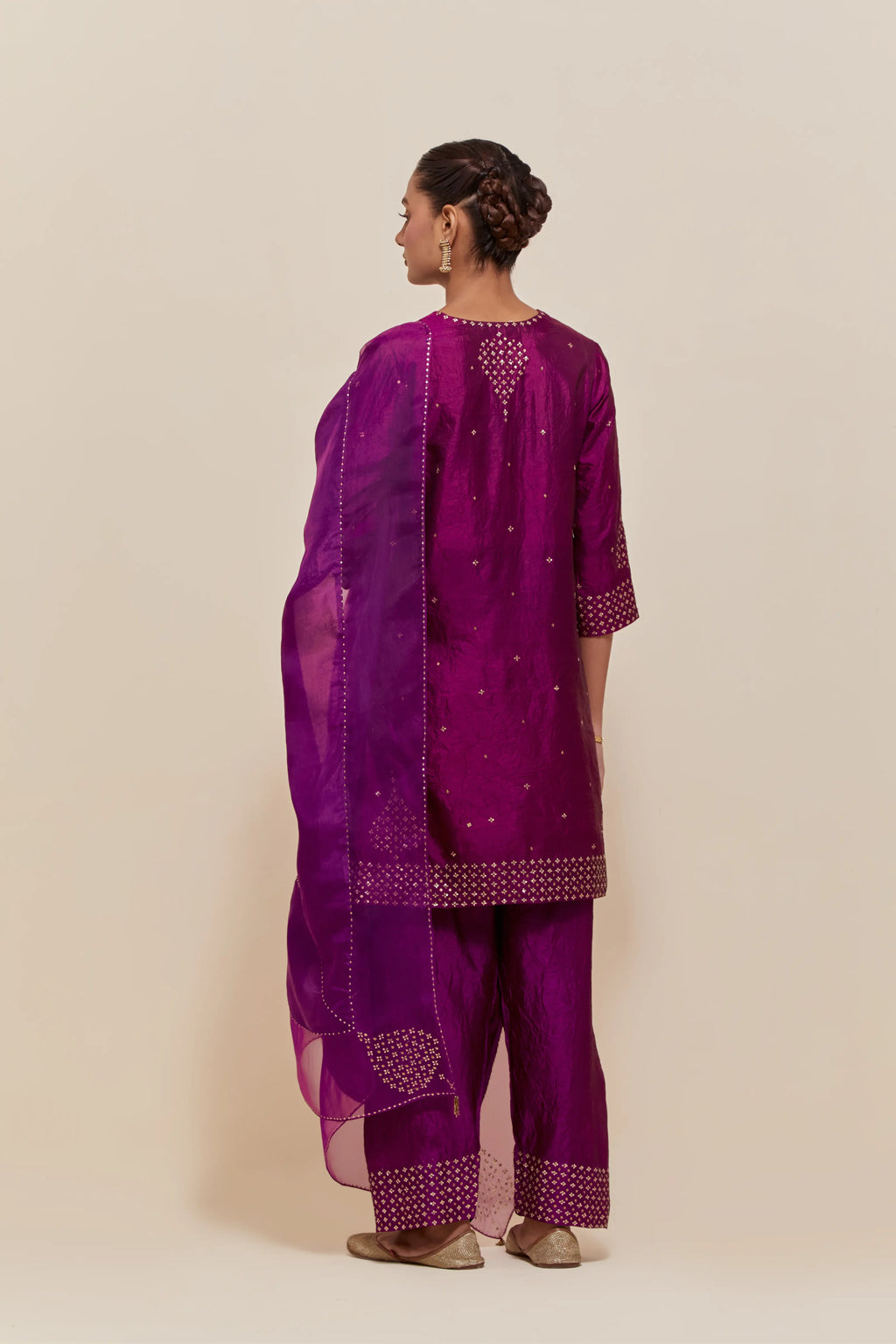 Purple silk dupatta with silk organza at the sides, highlighted with hand-embroidered gold sequins work.