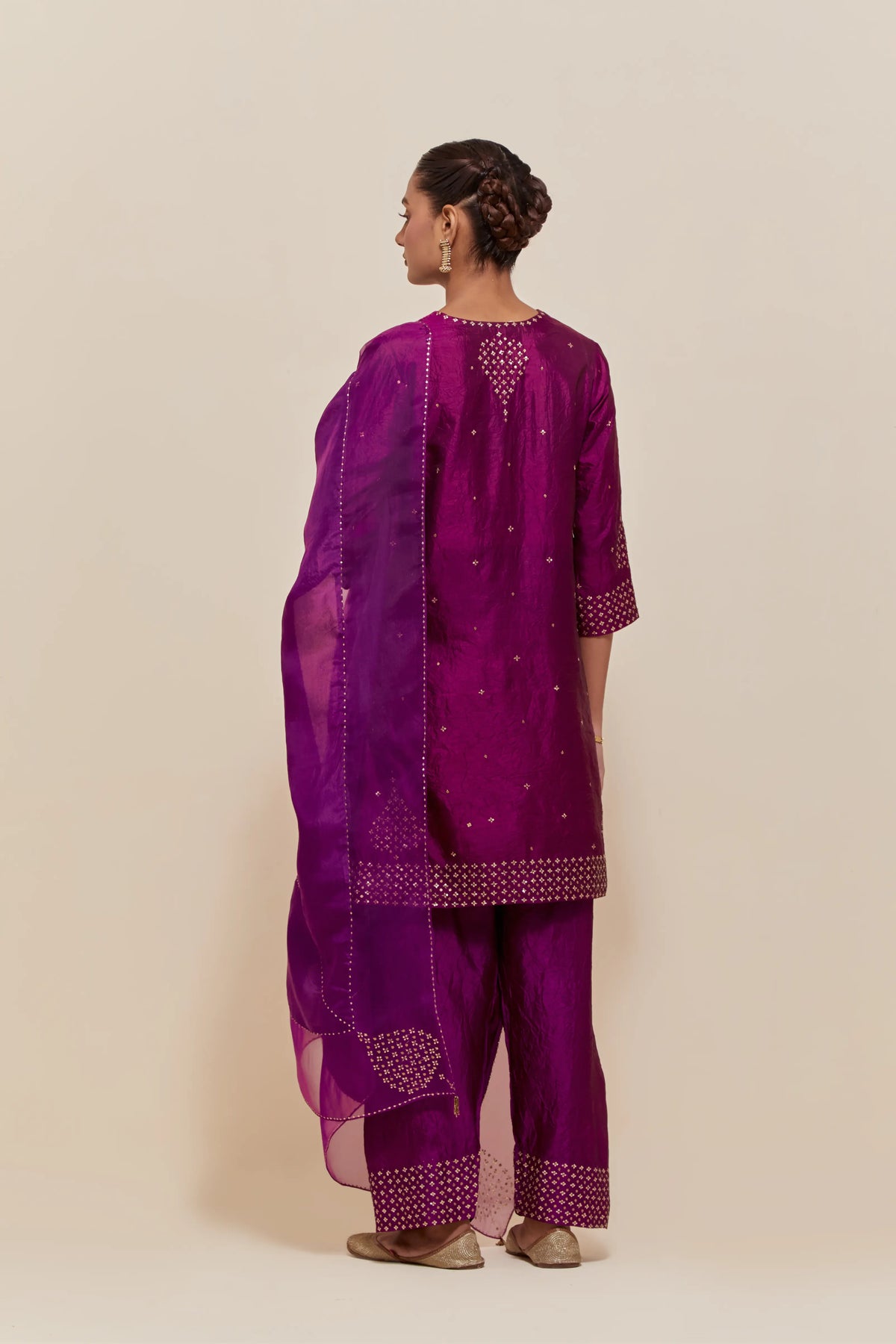 Purple silk dupatta with silk organza at the sides, highlighted with hand-embroidered gold sequins work.