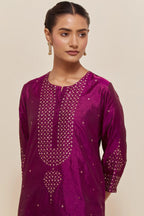 Purple silk straight short kurta set with hand-embroidered sequins at the neck, borders running along the hem and sleeve edges, and scattered gold sequins embellishments all-over.