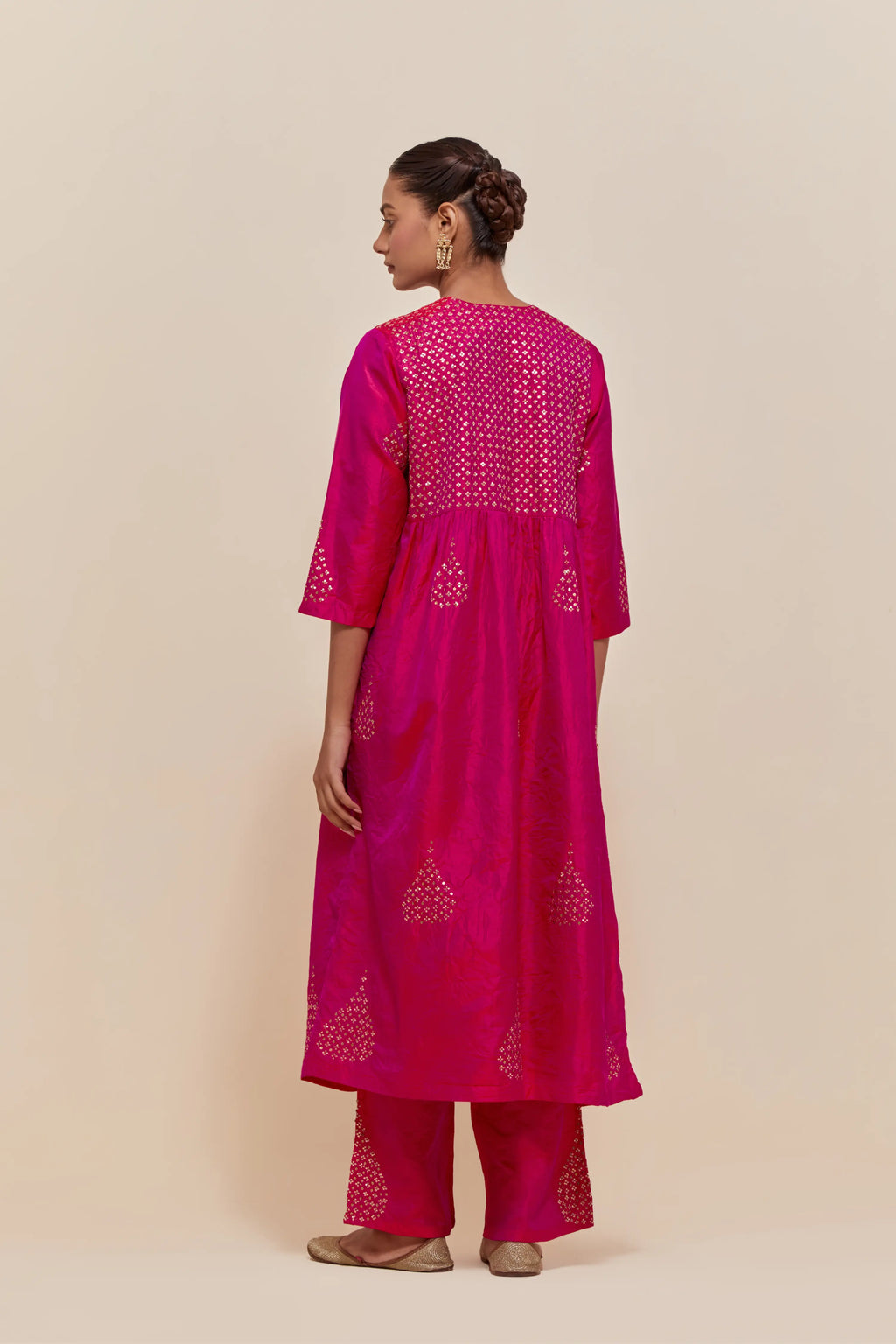 Fuchsia silk kurta set with hand embroidered sequins at yoke and leaf motif all-over the kurta.