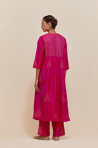 Fuchsia silk kurta set with hand embroidered sequins at yoke and leaf motif all-over the kurta.