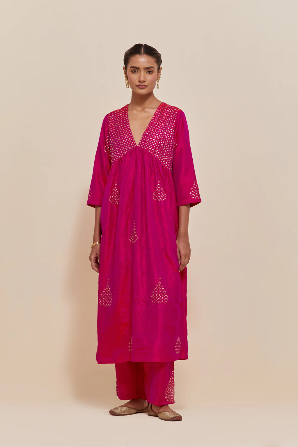 Fuchsia silk kurta set with hand embroidered sequins at yoke and leaf motif all-over the kurta.