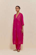 Fuchsia silk kurta set with hand embroidered sequins at yoke and leaf motif all-over the kurta.