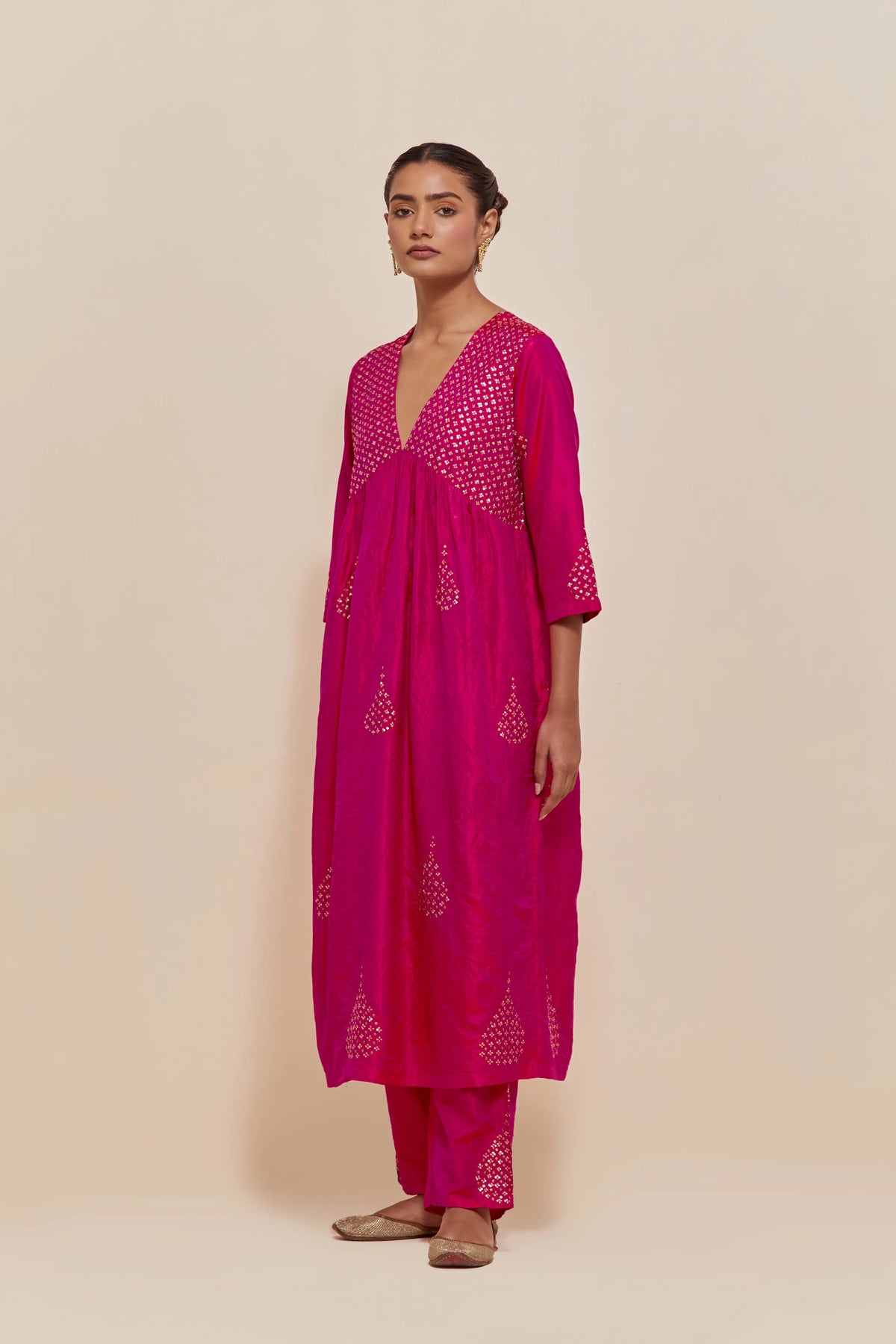 Fuchsia silk kurta set with hand embroidered sequins at yoke and leaf motif all-over the kurta.