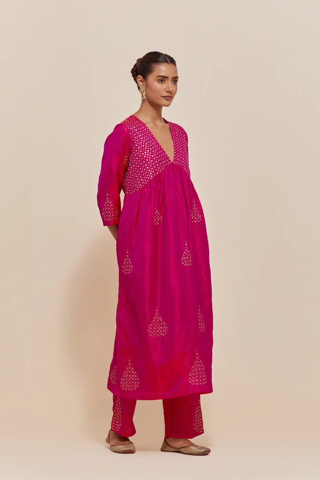 Fuchsia silk kurta set with hand embroidered sequins at yoke and leaf motif all-over the kurta.