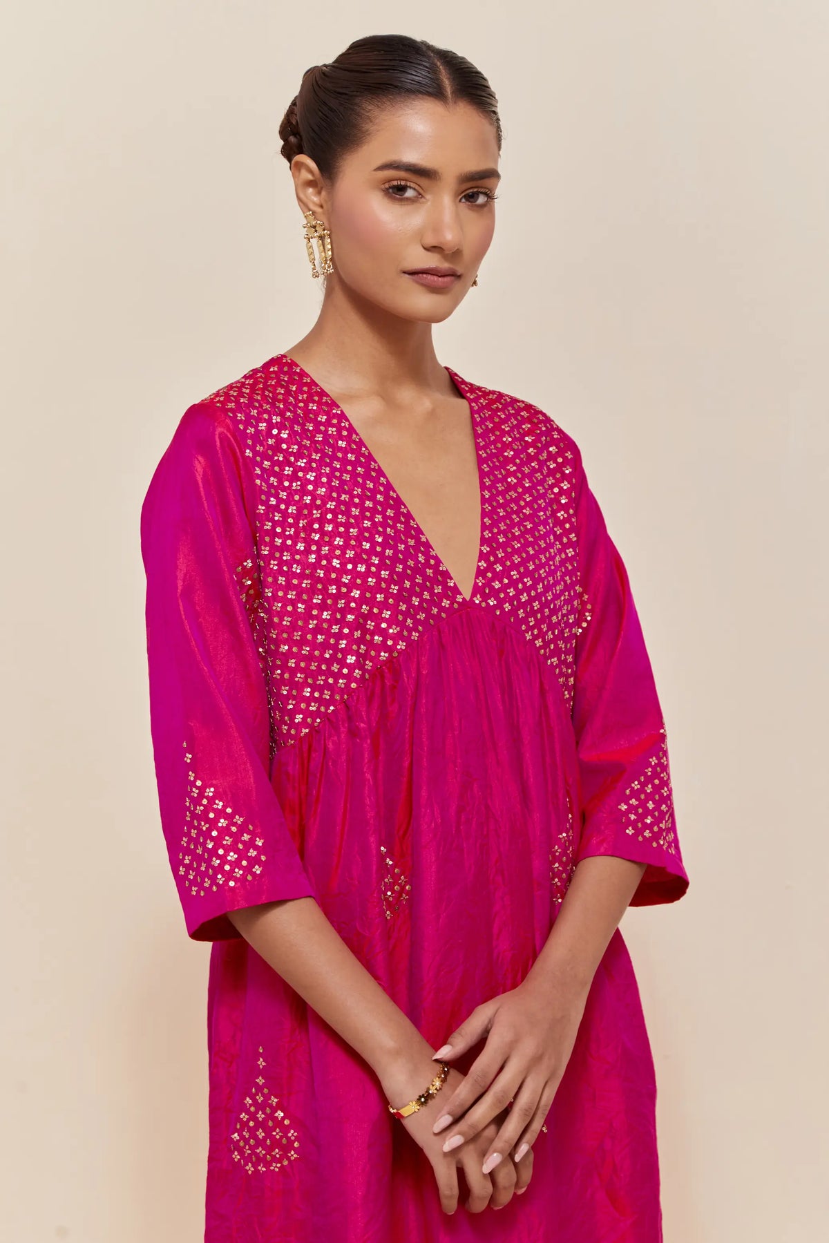 Fuchsia silk kurta set with hand embroidered sequins at yoke and leaf motif all-over the kurta.