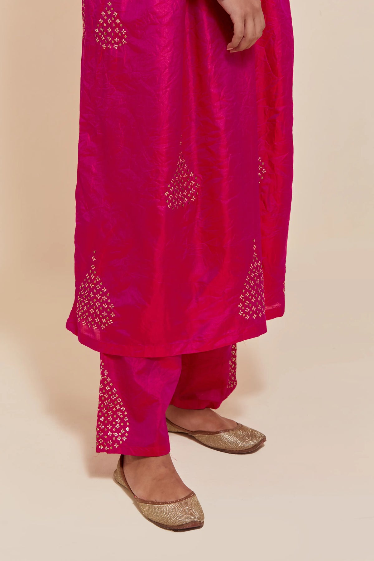 Fuchsia silk kurta set with hand embroidered sequins at yoke and leaf motif all-over the kurta.
