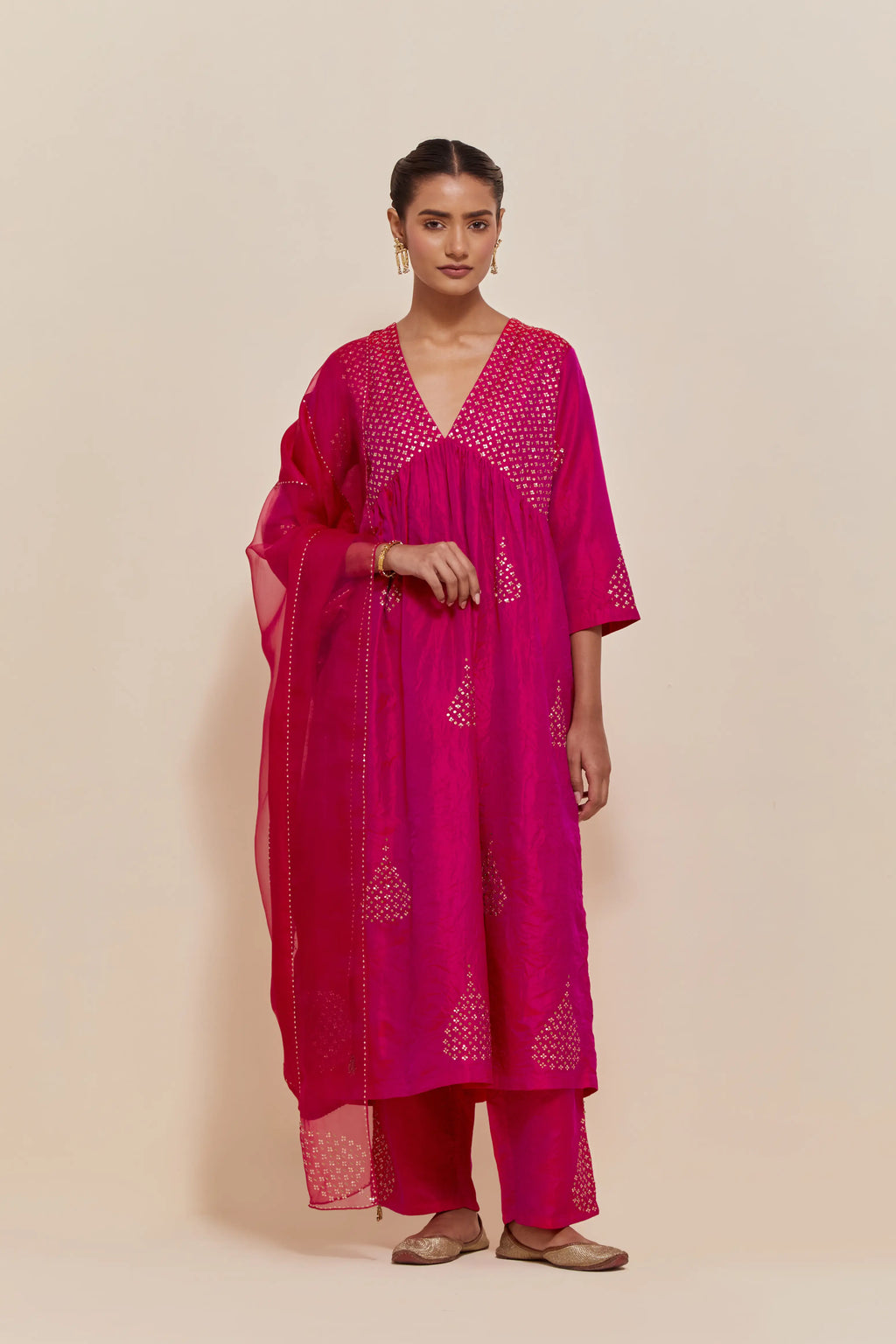 Fuchsia silk kurta set with hand embroidered sequins at yoke and leaf motif all-over the kurta.