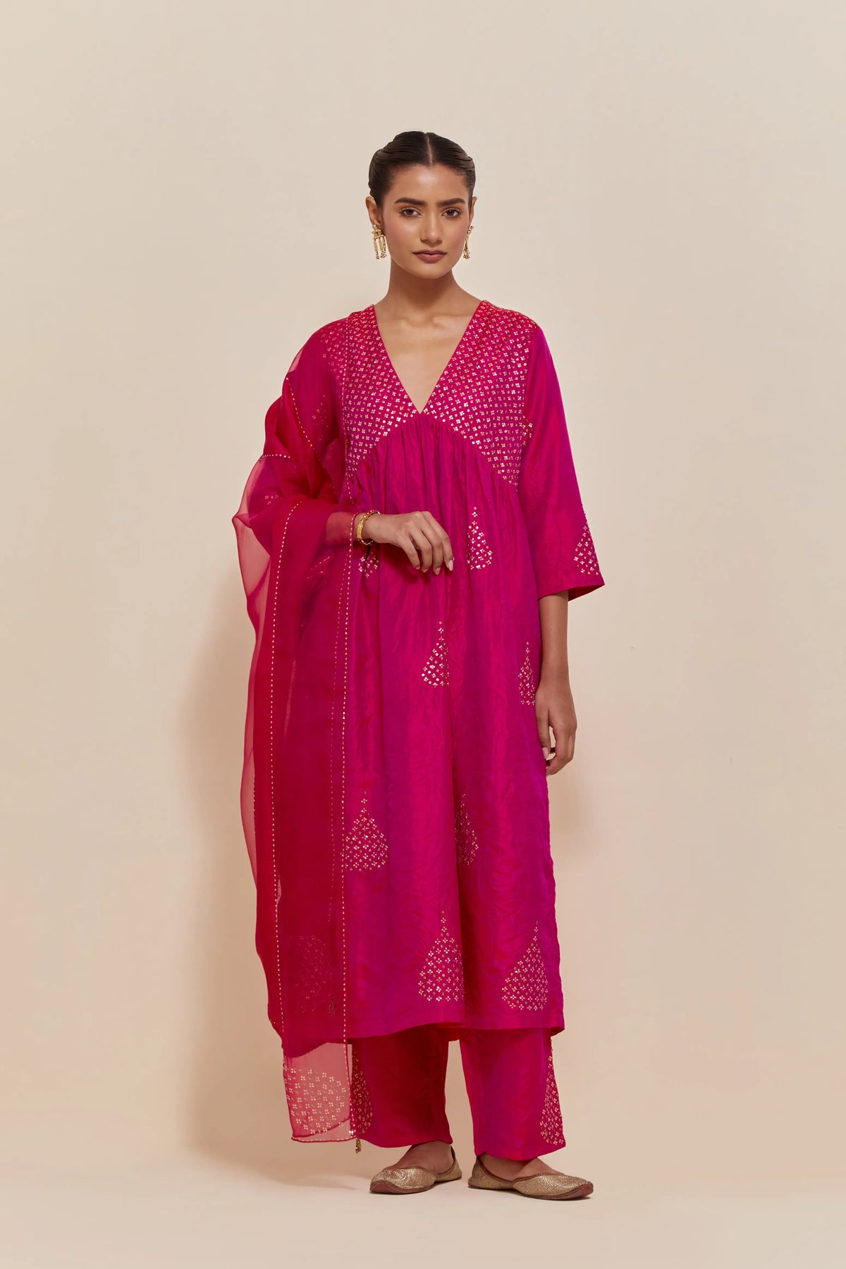 Fuchsia silk kurta set with hand embroidered sequins at yoke and leaf motif all-over the kurta.